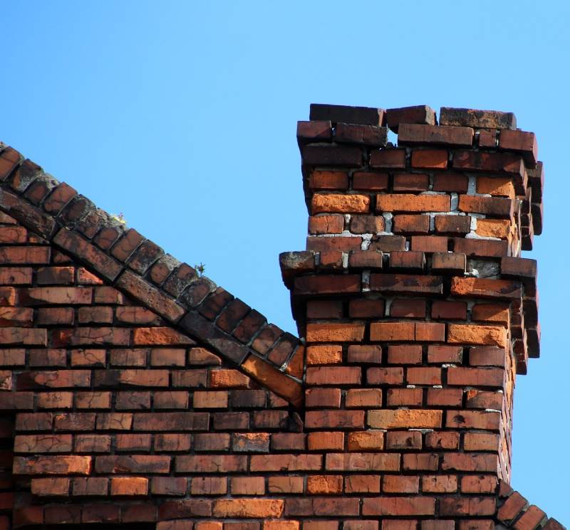 Signs Your San Diego Home Needs a Chimney Inspection Damaged chimney on an San Diego home showing cracks and missing mortar